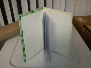 a notebook on the other.